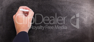 Composite image of hand writing with chalk