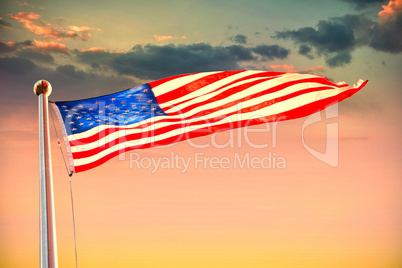 Composite image of american flag waving over white background