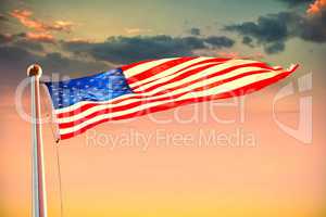 Composite image of american flag waving over white background