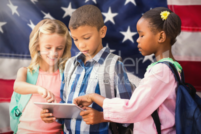 Composite image of students using digital tablet