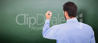 Composite image of businessman in suit writing with marker