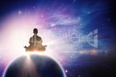 Composite image of silhouette man doing meditation