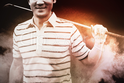 Composite image of golfer standing and holding his club smiling at camera