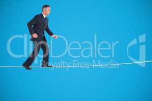 Composite image of businessman walking on white background