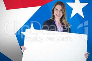 Composite image of beautiful businesswoman holding blank billboard over white background