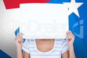 Composite image of woman holding blank sign in front of face