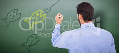 Composite image of businessman in suit writing with marker