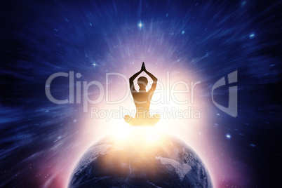 Composite image of silhouette female practicing yoga while sitting