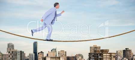 Composite image of stepping businessman