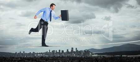Composite image of walking and smiling businessman with suitcase