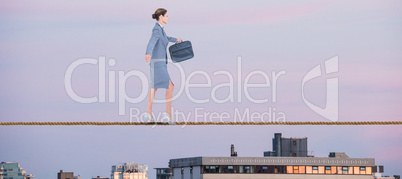 Composite image of businesswoman walking with briefcase over white background