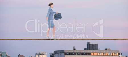 Composite image of businesswoman walking with briefcase over white background