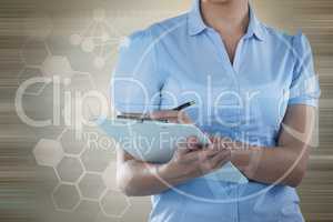 Composite image of beautiful businesswoman writing on clipboard