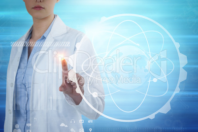 Composite image of female doctor using digital screen