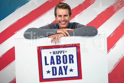 Composite image of smiling man on table against white background