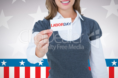 Composite image of smiling woman showing card