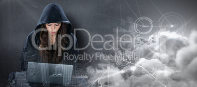 Composite image of young female hacker using laptop while sitting