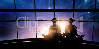 Composite image of silhouette man and woman doing meditation