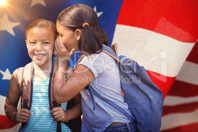 Composite image of girl with backpack whispering in friend ear