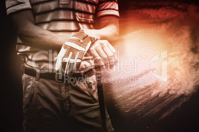 Composite image of man holding a golf club