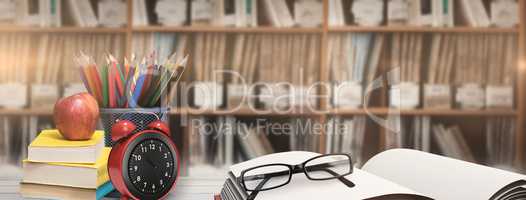 Composite image of school supplies on desk