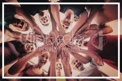 People stacking hands at health club