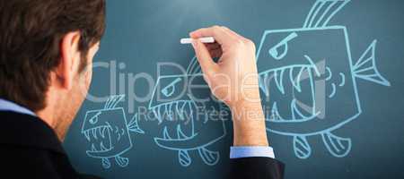 Composite image of businessman writing with a white chalk