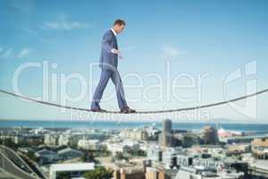 Composite image of businessman walking
