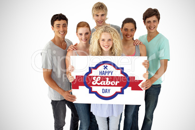 Composite image of group of teenagers holding a blank card