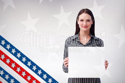 Composite image of pretty woman holding a white sheet of paper