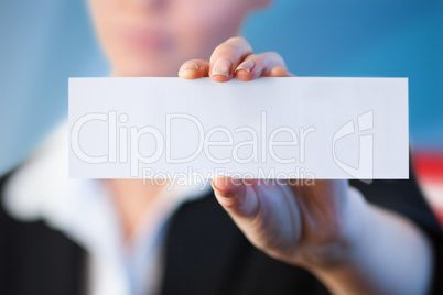 Composite image of close up of businesswoman holding blank card