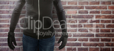 Composite image of robber wearing black hoodie
