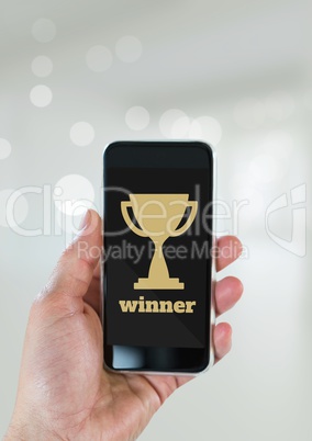 Person holding a phone with a trophy icon