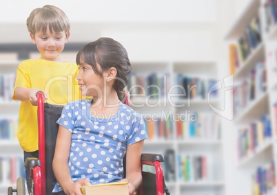 Disabled girl in wheelchair with friend in school library