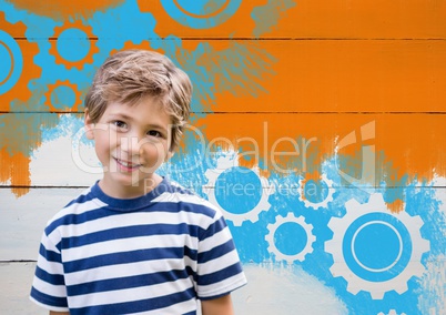 Boy in front of painted orange wall and settings cogs gears