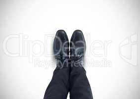 Black shoes on feet with white background