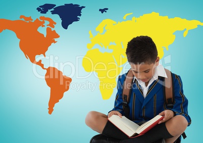 Schoolboy reading in front of colorful world map