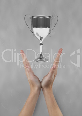 Woman with a trophy on hands