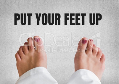 Put your feet up text and Bare feet and grey stone background