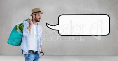 Man with speech bubble holding a bag against grey background