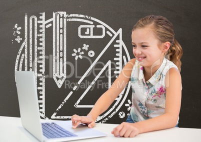 Happy student girl at table using a computer against grey blackboard with school and education graph
