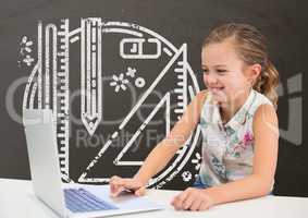 Happy student girl at table using a computer against grey blackboard with school and education graph