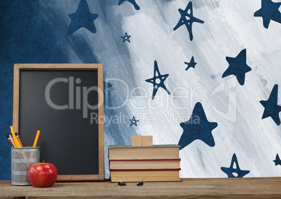 Desk foreground with blackboard graphics of stars