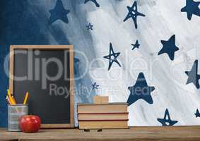 Desk foreground with blackboard graphics of stars