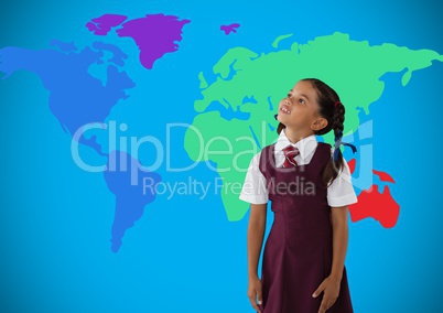 Schoolgirl looking up in front of colorful world map