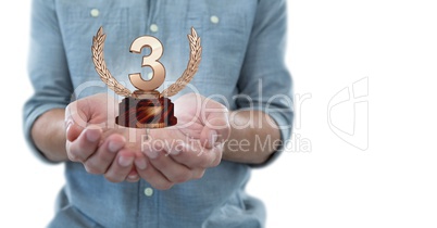 Man with a trophy on hands