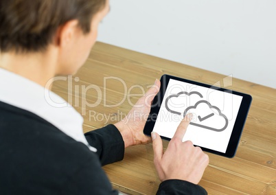 Cloud tick icons on tablet with hand