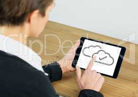 Cloud tick icons on tablet with hand