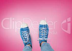 Blue shoes on feet with red background