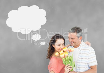 Couple with speech bubble thinking against grey background